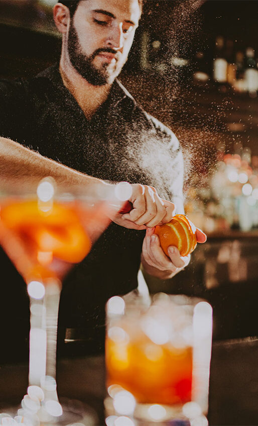 Bartender making a handcrafted cocktail at Bacchus Lounge at Queen's Landing in Niagara-on-the-Lake