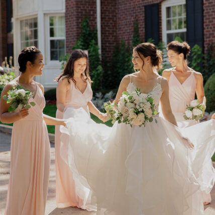 Bridesmaids walking at an Ontario wedding venue