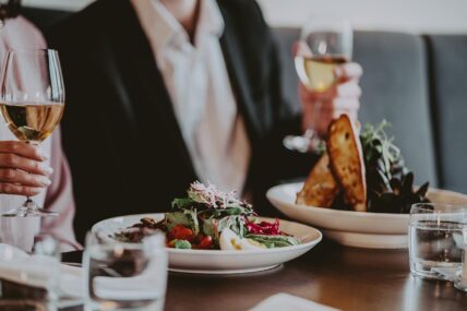 A couple enjoying a meal at the Inn On The Twenty Restaurant.