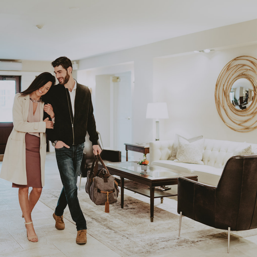 Couple checking into Inn On The Twenty Hotel in Jordan, Ontario